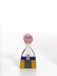 Colorful wooden figurine featuring pink, white, yellow, blue, and black geometric patterns. Ideal for decor.