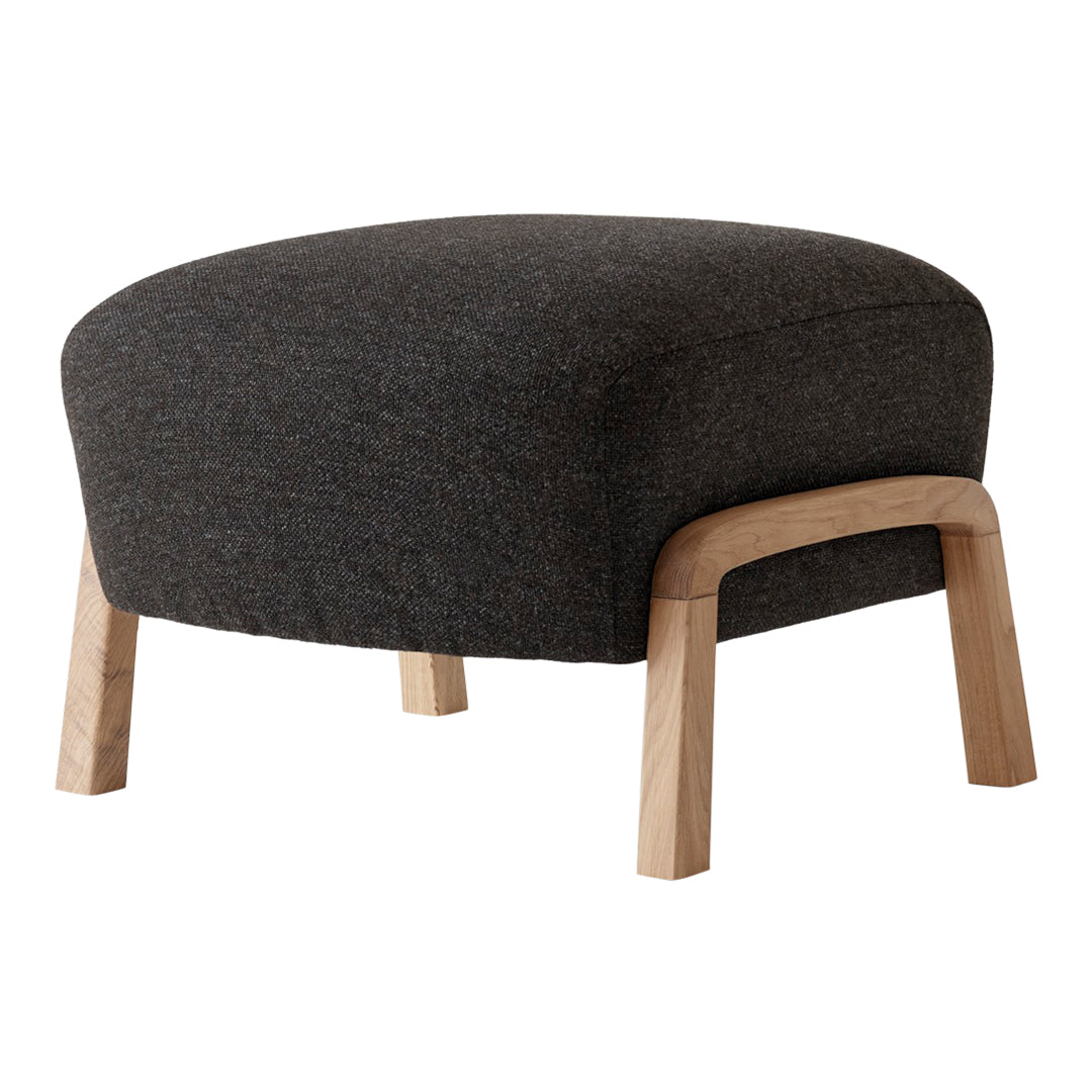 Dark gray upholstered ottoman with a textured finish and light wood legs. Modern and minimalist design element.