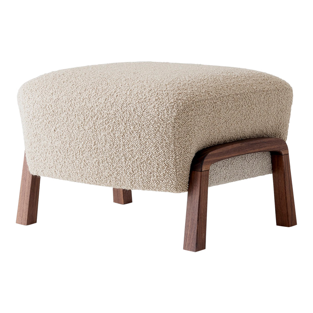 Beige textured ottoman with wooden legs, featuring a soft, cozy pattern perfect for modern interiors.