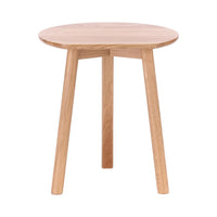 Natural wood round side table with a smooth finish and light oak color, showcasing minimalistic design and clean lines.