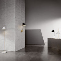 Modern floor and wall lamps with black, white, and gold accents against a minimalist gray backdrop.