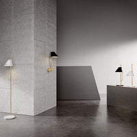 "Modern floor and wall lamps in black, white, and gold against a sleek gray backdrop."