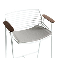 White metal chair with grey seat cushion and walnut armrests, featuring a sleek, modern striped design.