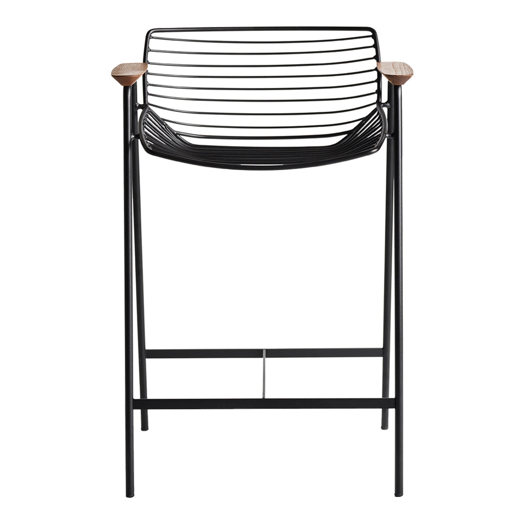 Black wire bar stool with wooden armrests, featuring a sleek slatted design for modern decor.