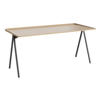Light beige tabletop with natural wood finish, supported by sleek black metal legs. Modern, minimalist design.