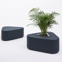 Triangular dark gray planter with smooth surface and inner metal rim, featuring a green plant for a modern look.
