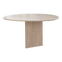 Round beige dining table with a smooth finish and subtle marbling pattern on the tabletop.