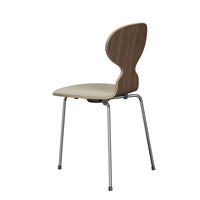 Modern chair with a dark wood veneer back and light beige seat, featuring sleek chrome legs for a stylish finish.