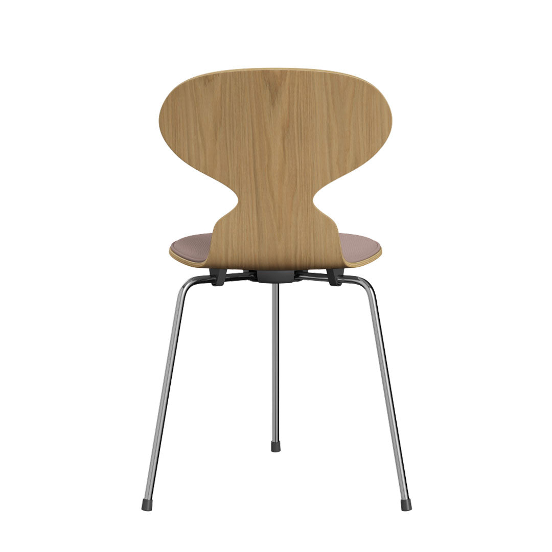 Curved wooden chair with a light oak finish and beige seat, featuring sleek metallic legs and minimalist design.