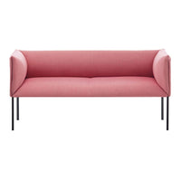 Pink upholstered sofa with sleek black legs, featuring a minimalist and modern design.
