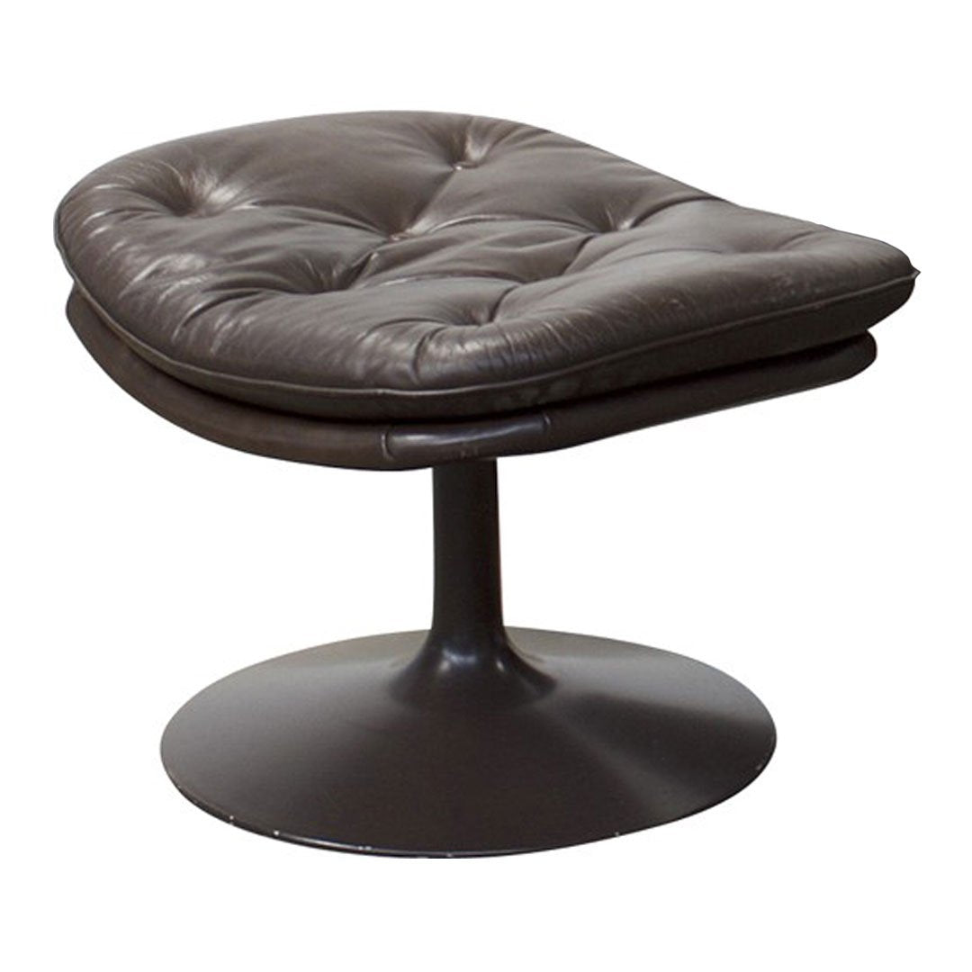 Brown leather swivel chair with tufted pattern and sleek black base, perfect for modern decor.