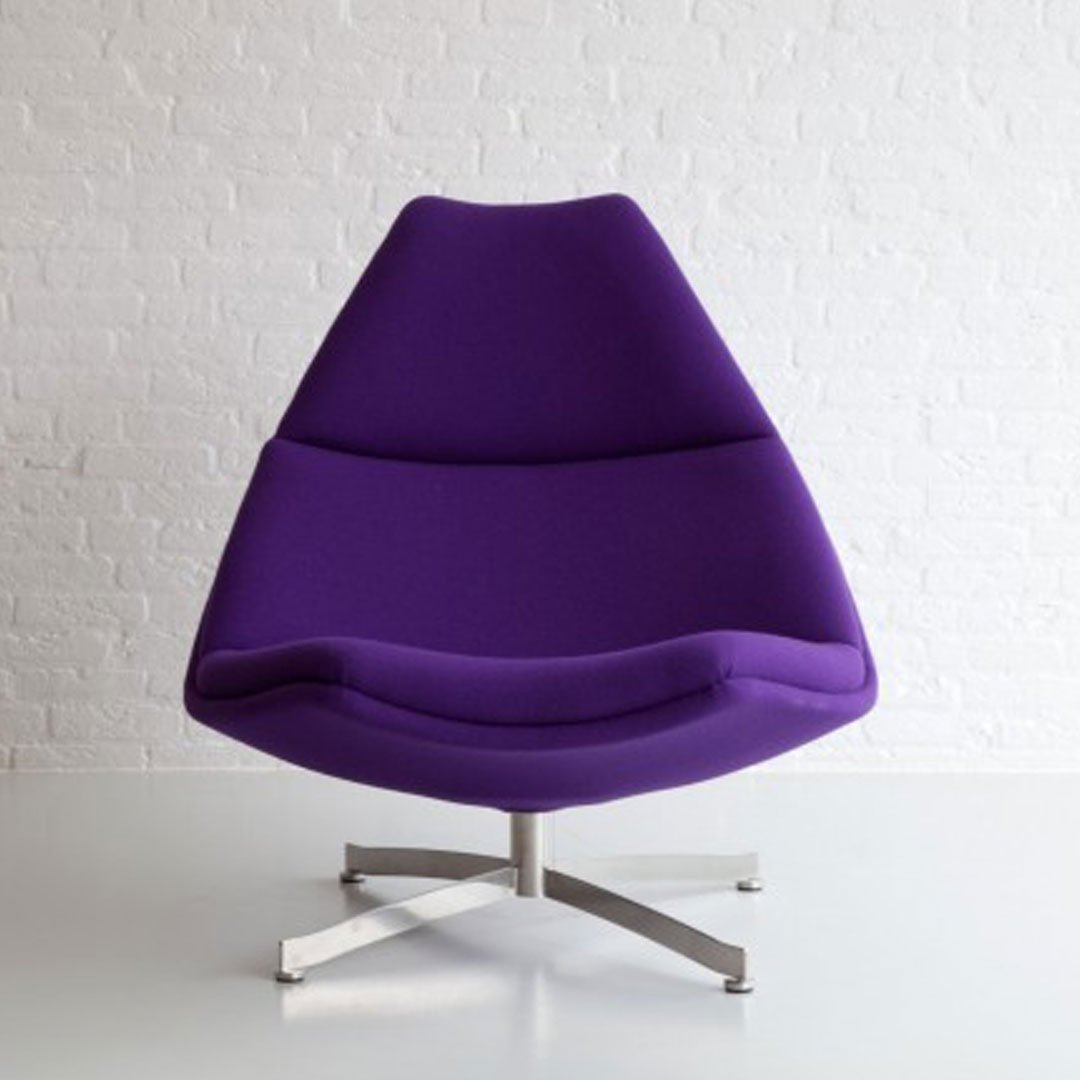 Vibrant purple upholstered chair with sleek silver legs, featuring a modern, smooth design.