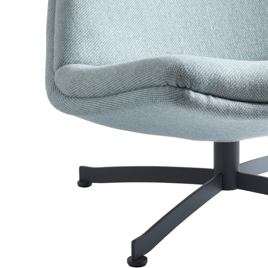 Light blue chair upholstery with a textured pattern and a sleek black metal base. Perfect for modern decor.