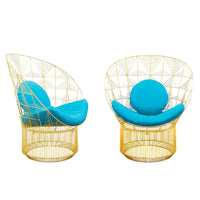 Stylish gold wire chairs with vibrant turquoise cushions, featuring geometric patterns for a modern look.