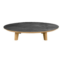 Round coffee table with a sleek black top and natural wood legs, featuring a minimalist design. Ideal for modern decor.