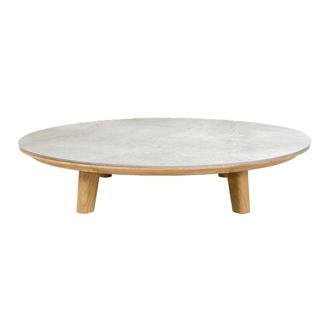 Round coffee table with a smooth gray top and natural wood legs, showcasing a modern, minimalistic design.