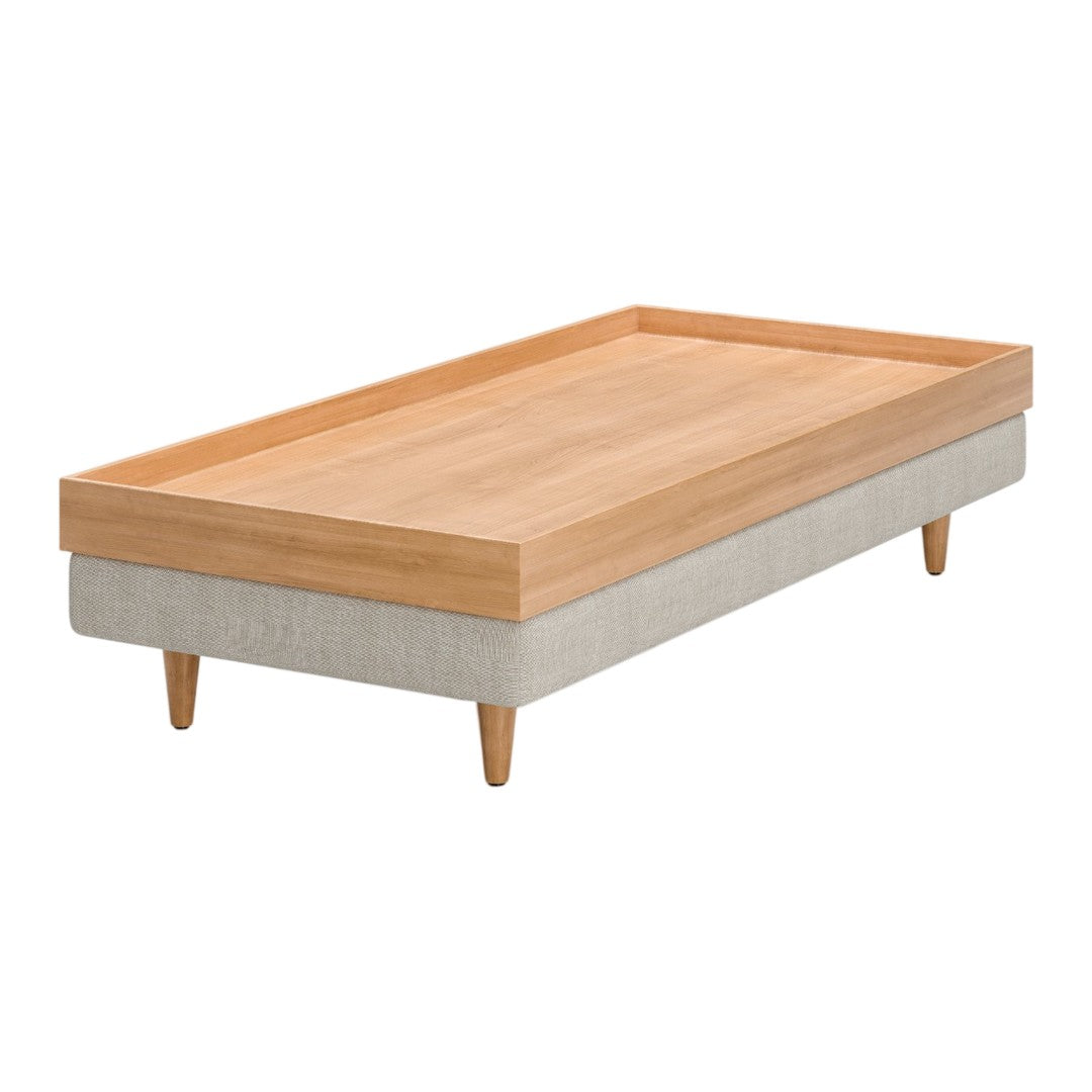 Light wood top with a natural finish, and a soft grey upholstered base; simple, modern design with clean lines.