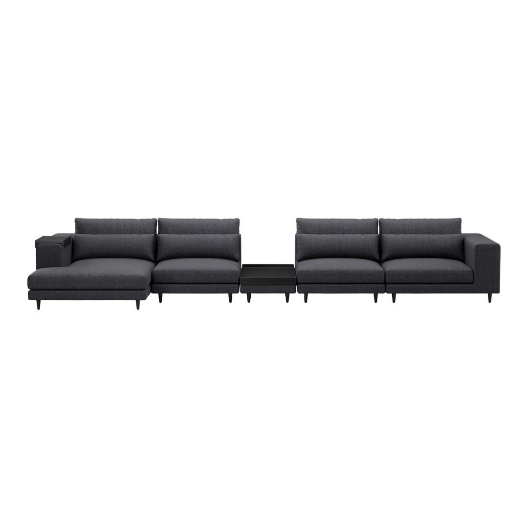 Modern sectional sofa in solid charcoal gray with smooth, textured upholstery and sleek black legs.