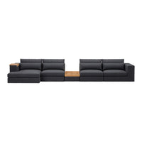 Modern sectional sofa in charcoal gray fabric with plush cushions and a natural wood accent.