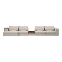 L-shaped sectional sofa in soft beige fabric, featuring plush cushions and a sleek wood accent table.