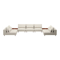 Cream-colored sectional sofa with smooth, clean lines and soft cushions. Elegant design complements modern décor.