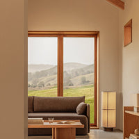 Warm earthy tones with soft beige and natural wood accents in a minimalist interior design.