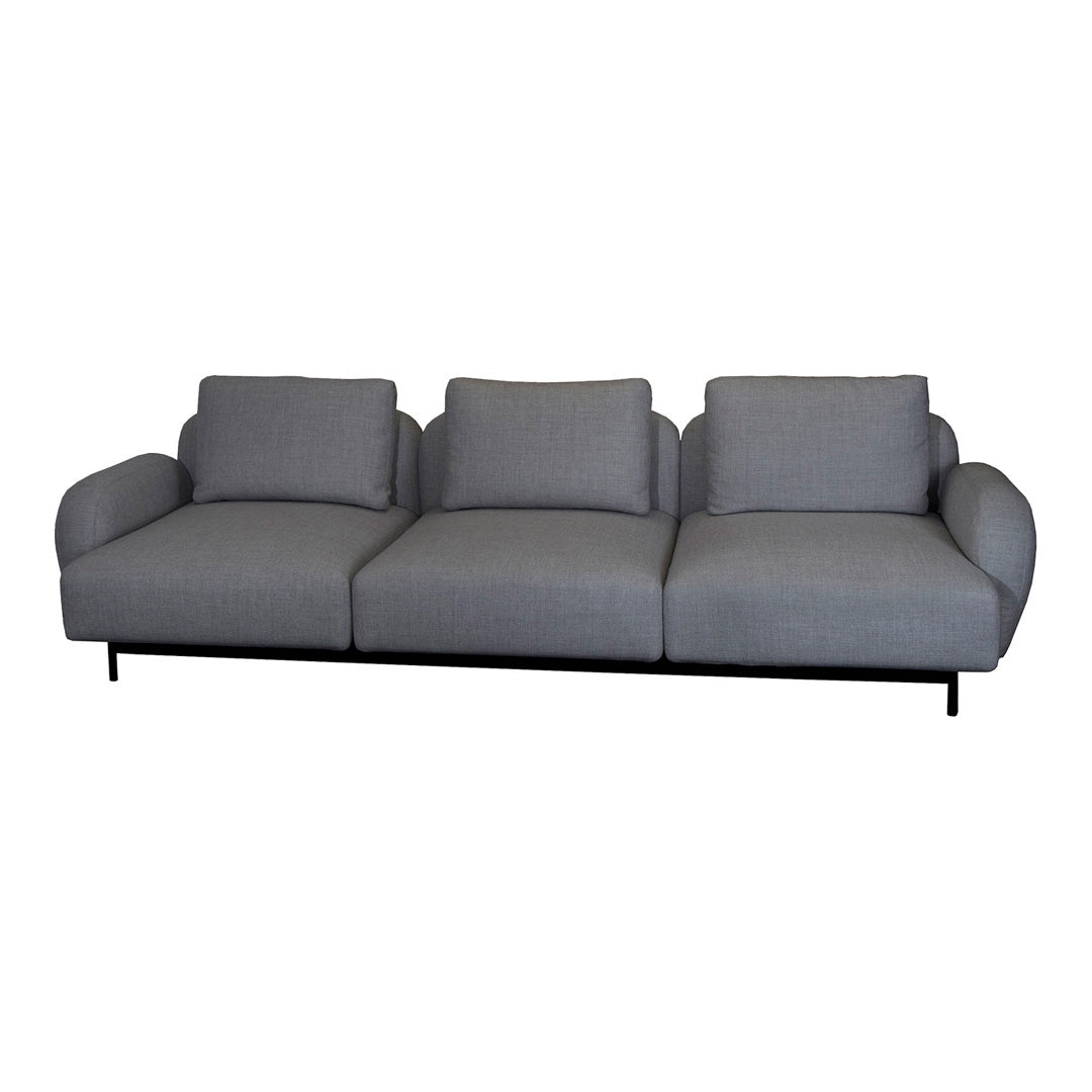 Gray upholstered sofa with smooth, subtle texture and clean lines, featuring three wide seats and a minimalist style.