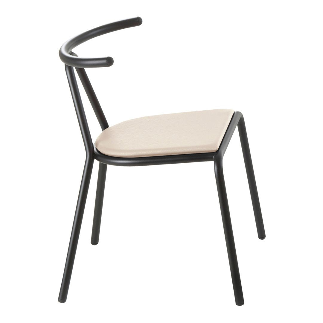 Black metal chair with a smooth cream seat, featuring a minimalist design and curved backrest. Perfect for modern decor.