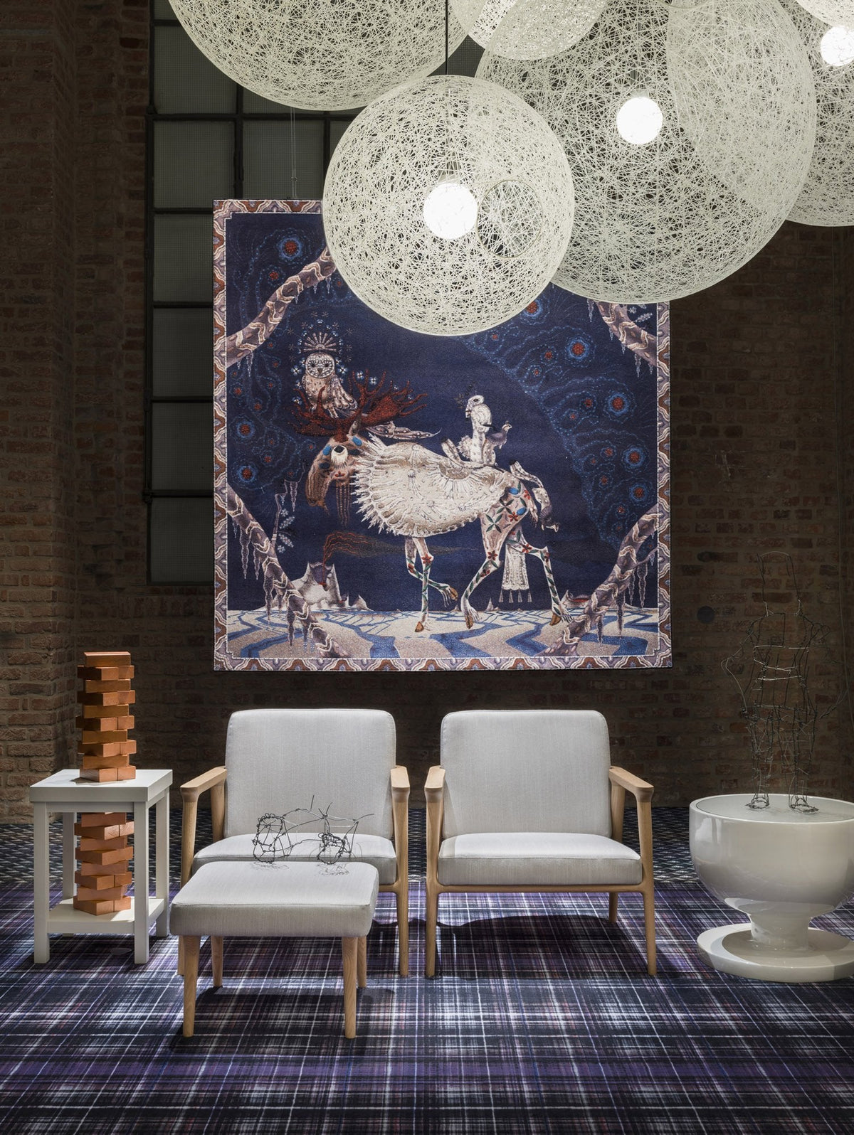 "Elegant tapestry with intricate blue and white patterns, surrounded by neutral-toned furniture and a checkered floor."