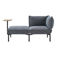 Gray textured fabric sofa with sleek black frame and natural wood accent table. Modern design for stylish interiors.
