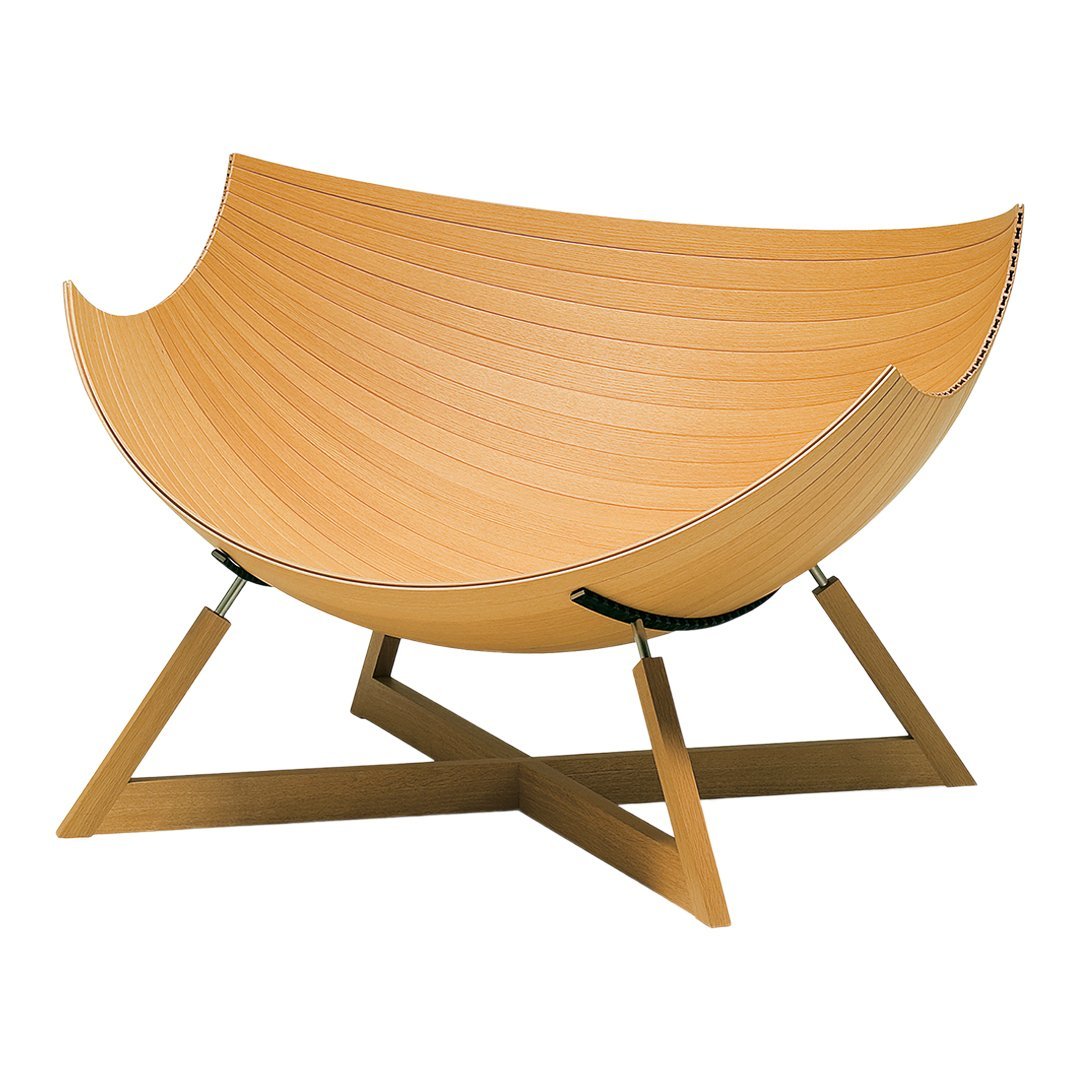 Stylish light wood chair featuring smooth, curved lines with a sleek, minimalist design and a warm, natural finish.
