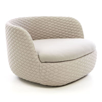 Beige quilted swivel chair with a smooth, rounded design and plush seat cushion. Ideal for modern decor.