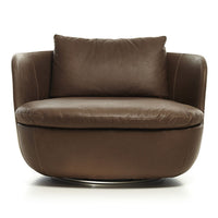 Brown leather accent chair with a smooth, rounded design and plush cushions, perfect for modern decor.