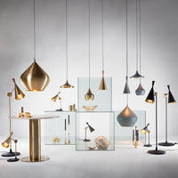 Stylish lighting fixtures featuring gold, black, and grey finishes, showcasing modern design and elegant patterns.