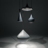 Three modern pendant lamps in varying shades of grey, featuring sleek, minimalist shapes and smooth finishes.