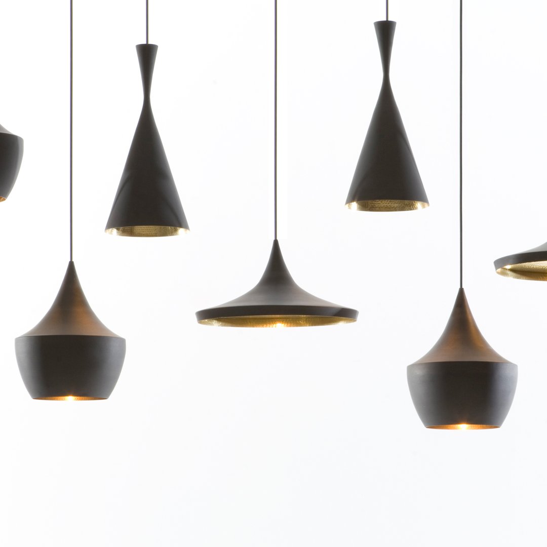 "Stylish black pendant lights with gold accents in modern geometric shapes."