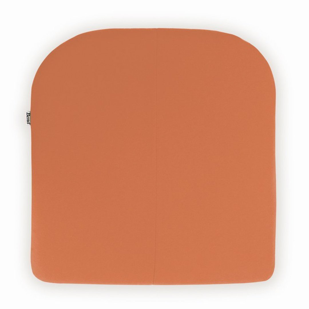 Orange ergonomic cushion with a smooth, rounded design for comfort and style.