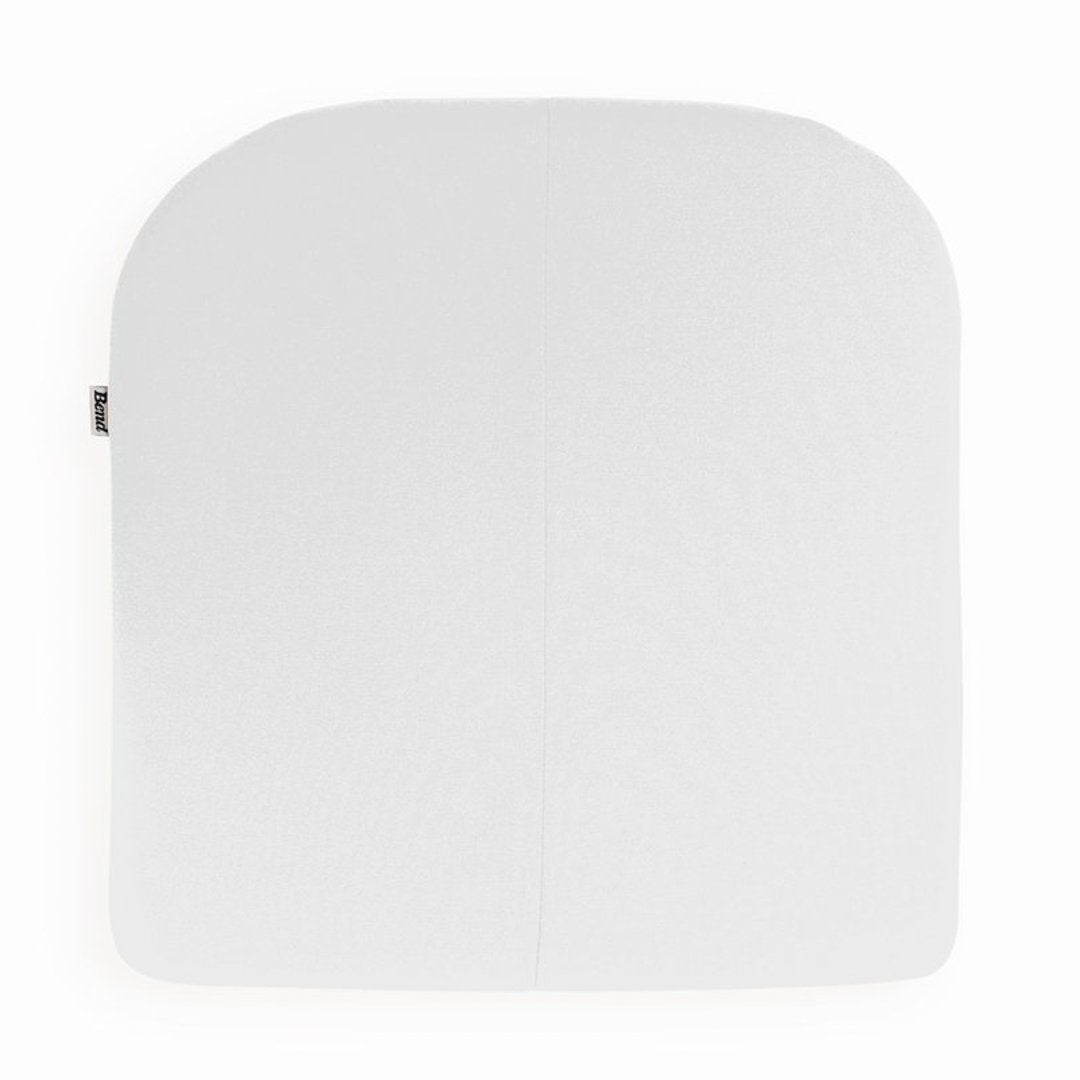 White square cushion with a smooth texture and rounded corners, perfect for minimalist decor.