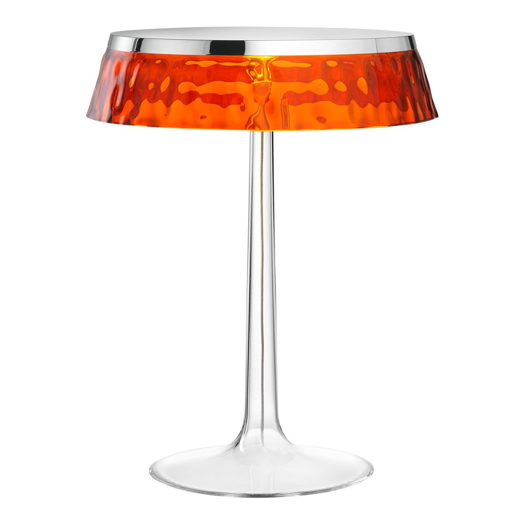 Stylish transparent table lamp with a textured orange shade and chrome accents, perfect for modern decor.