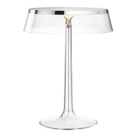 Clear glass table lamp with a sleek chrome accent and a modern, minimalist design. Perfect for stylish lighting.