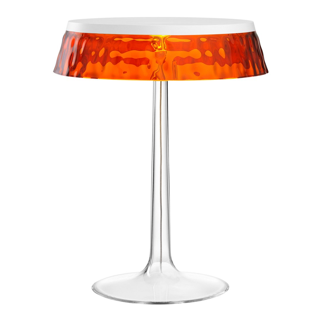 Modern table lamp with a clear base and a vibrant orange, textured shade. Elegant design perfect for any decor.