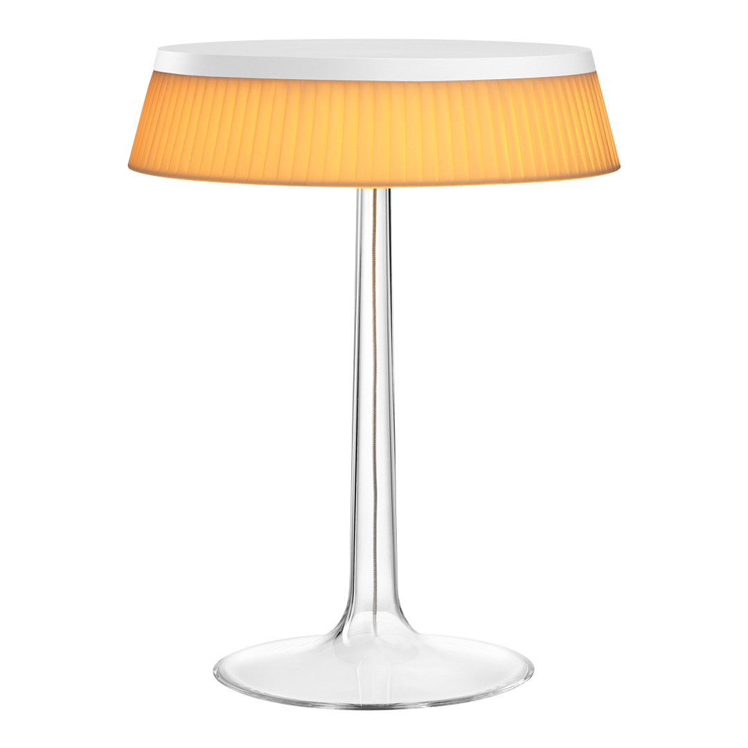 Modern clear base lamp with orange pleated shade, perfect for adding a touch of color and style to any space.