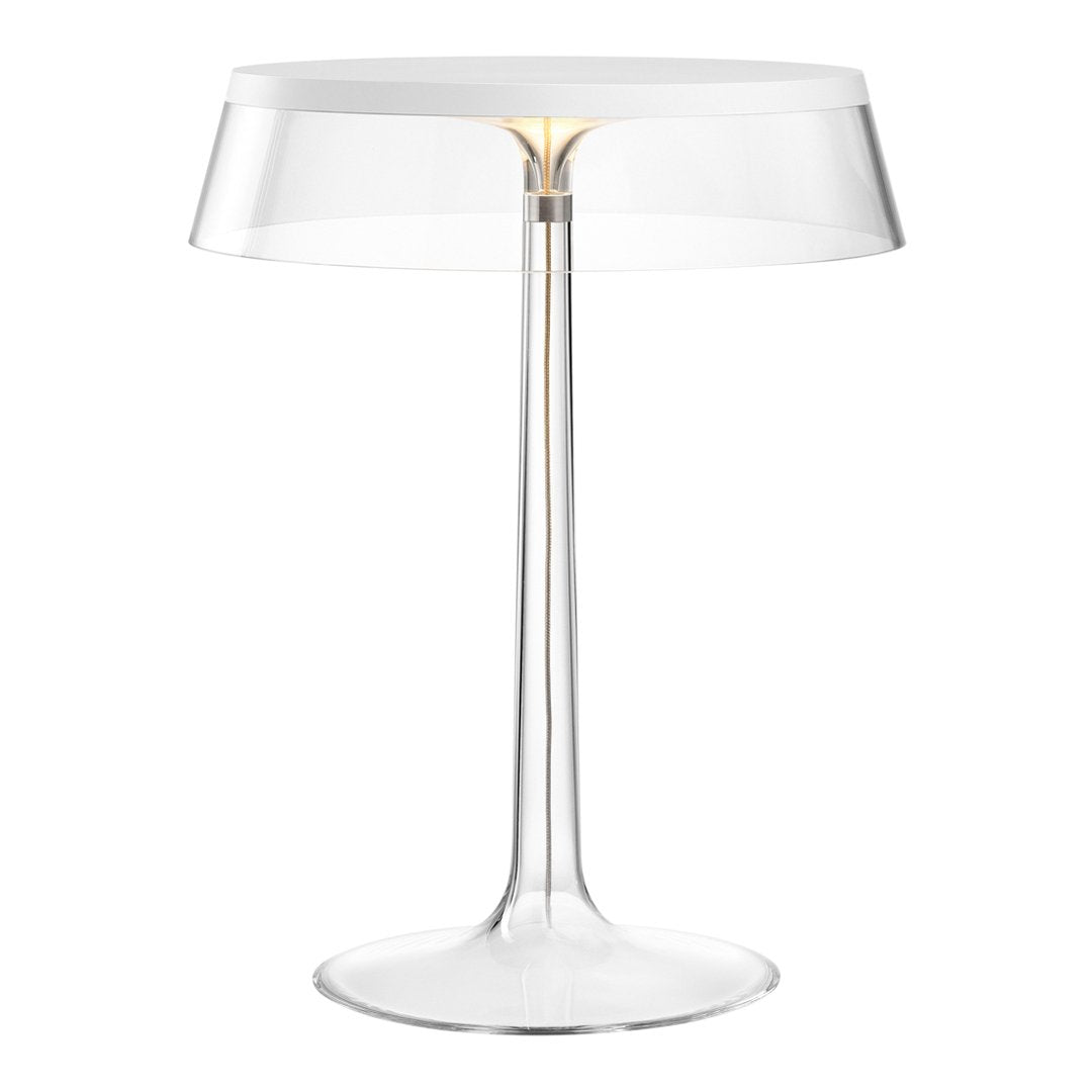 Clear acrylic lamp with a sleek, minimalist design and subtle gold accents, perfect for modern decor.