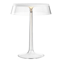 Clear acrylic lamp with a sleek, minimalist design and subtle gold accents, perfect for modern decor.