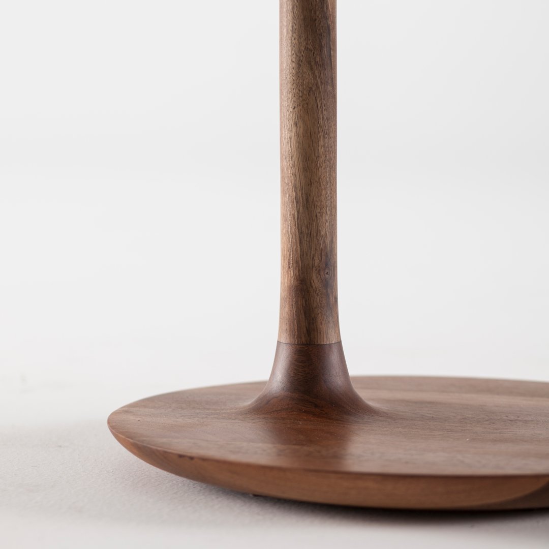 Wooden base with a smooth, circular design and a natural matte finish, featuring rich brown tones and subtle grain patterns.