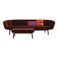 Brown modern sofa with colorful purple and orange accent pillows, featuring a minimalist design and sleek black legs.