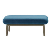 Modern blue velvet ottoman with a sleek metal frame, perfect for stylish home decor.