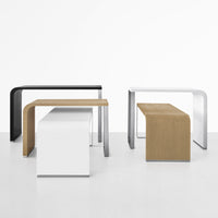 Black, white, and natural wood accent tables with sleek, modern lines and minimalist design.