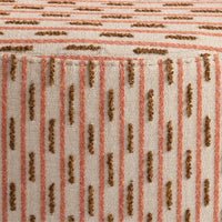 Beige fabric with vertical stripes in pink and brown, featuring a textured pattern of dots and lines.