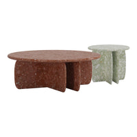 Round coffee tables in rust and green speckled hues, showcasing modern terrazzo patterns. Perfect for stylish decor.
